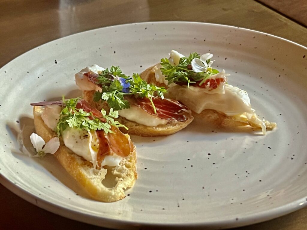 Mon Ami; Amuse Bouche (Iberian Jamon with Burrata, Calabria Chile on a crustini)