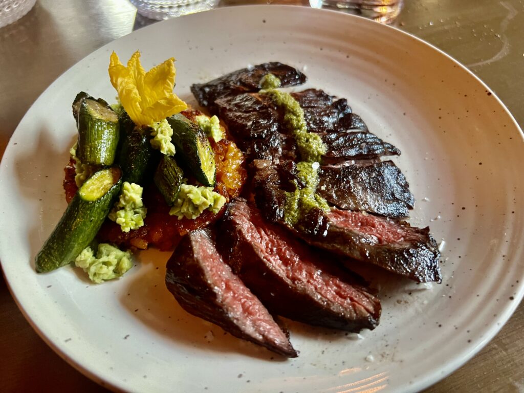 Mon Ami; Marinated Skirt Steak with a side of Spanish Rice and Roasted Zucchini