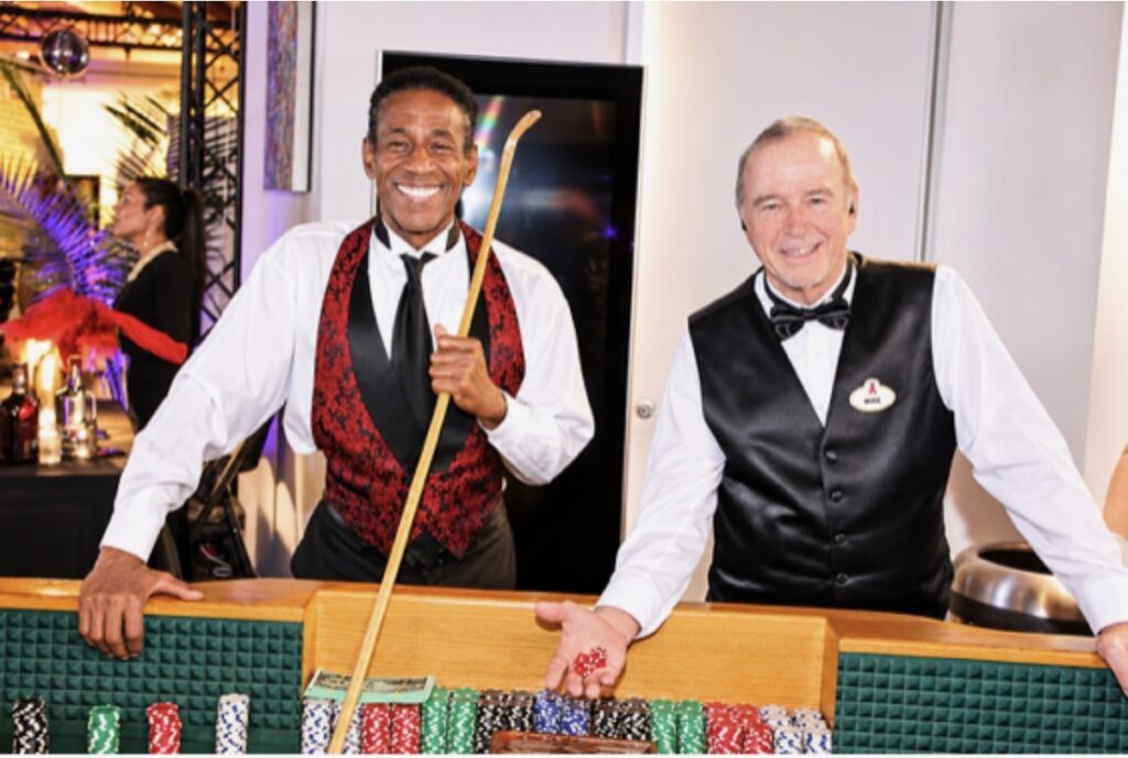 Dapper looking Professional croupiers / dealers were all smiles at the gambling tables. Photo Claudia LaRoche
